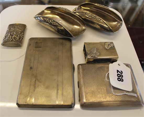 Two silver engine-turned cigarette cases, pair silver [900] ashtrays, cast decoration, silver [830] vesta & match holder